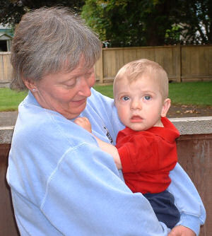 Sandra holding Christopher Hartnett.