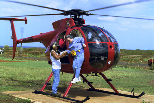 Sandra exiting helicopter.